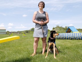 Lisa-Marie Guernon, owner of Muzzles and Snouts boarding and dog training in Prince Edward County, is seen here with Ava, who is currently in training to become a PTSD Service Dog. 

Emily Mountney/The Intelligencer/QMI Agency