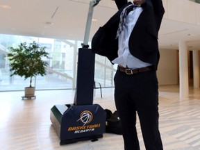 Mayor Don Iveson does a reverse dunk in the City Room.  The Canadian Women Basketball team was introduced at City Hall in Edmonton, Alta., on Monday, June 10, 2014. The mayor welcomes back the team to EdmontonPerry Mah/Edmonton Sun