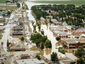 Water takes over downtown High River at the height of the June 2013 flood. (Lyle Aspinall/Calgary Sun)