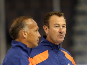 Kelly Buchberger, left, is moving into a player development position with the Oilers, while Steve Smith has been offered the job of tracking games from the press box. (Perry Mah, Edmonton Sun)