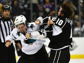 San Jose Sharks forward Logan Couture fights Los Angeles Kings centre Mike Richards during Game 6 of their NHL Western Conference quarterfinal series at the Staples Center in Los Angeles, April 28, 2014. (KELVIN KUO/USA Today)