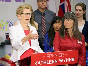 Ontario Premier and Liberal leader Kathleen Wynne speaks at St. Lawrence College in Kingston on Tuesday, where she met with staff and students of the Early Childhood Education program as part of a Ontario election campaign stop. On the right is Kingston and the Islands Liberal candidate Sophie Kiwala IAN MACALPINE/THE WHIG-STANDARD