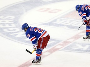 New York Rangers’ Martin St. Louis and Mats Zuccarello skate off the ice after being shut out in Game 3 of the Stanley Cup final on June 9, 2014. (ADAM HUNGER/USA TODAY Sports)