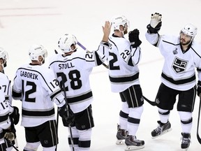 The Los Angeles Kings celebrate their Game 3 victory over the New York Rangers in the Stanley Cup final. (Adam Hunger, USA Today Sports)