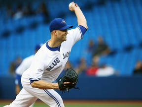 Toronto Blue Jays starting pitcher J.A. Happ throws against the Minnesota Twins at the Rogers Centre in Toronto, June 10, 2014. (TOM SZCZERBOWSKI/USA Today)