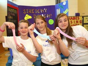 JOHN LAPPA/THE SUDBURY STAR/QMI AGENCY 
R. L. Beattie Public School students Mallorie Alexander, left, Beth Wiwchar and Taryn Thompson show their stretchy dough they have on display at the Rainbow District School Board Entrepreneur Fair at Lo-Ellen Park Secondary School in Sudbury. The fair, which was hosted by Learning Initiative and the Regional Business Centre, featured 32 business projects from 65 students.