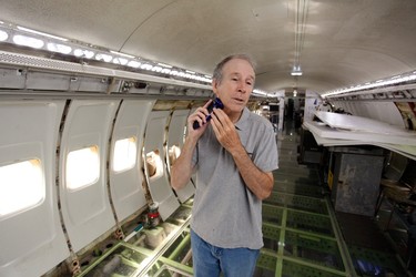 Bruce Campbell shaves in his Boeing 727 home in the woods outside the suburbs of Portland, Oregon May 21, 2014. In 1999, the former electrical engineer had a vision: To save retired jetliners from becoming scrap metal by reusing them. Campbell, 64, is one of a small number of people worldwide who have transformed retired aircraft into a living space or other creative project, although a spokesman for the Aircraft Fleet Recycling Association was unable to say precisely how many planes are re-used this way. Picture taken May 21.  REUTERS/Steve Dipaola