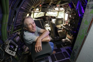 Bruce Campbell sits in the cockpit of his Boeing 727 home in the woods outside the suburbs of Portland, Oregon May 21, 2014. In 1999, the former electrical engineer had a vision: To save retired jetliners from becoming scrap metal by reusing them. Campbell, 64, is one of a small number of people worldwide who have transformed retired aircraft into a living space or other creative project, although a spokesman for the Aircraft Fleet Recycling Association was unable to say precisely how many planes are re-used this way. Picture taken May 21.  REUTERS/Steve Dipaola