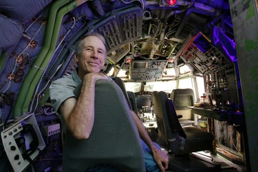 Bruce Campbell sits in the cockpit of his Boeing 727 home in the woods outside the suburbs of Portland, Oregon May 21, 2014. In 1999, the former electrical engineer had a vision: To save retired jetliners from becoming scrap metal by reusing them. Campbell, 64, is one of a small number of people worldwide who have transformed retired aircraft into a living space or other creative project, although a spokesman for the Aircraft Fleet Recycling Association was unable to say precisely how many planes are re-used this way. Picture taken May 21.  REUTERS/Steve Dipaola
