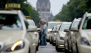 Taxi drivers protest on June 11, 2014 in Hamburg. Taxi drivers in London, Paris and other European capitals brought chaos to the streets in protest against new car-hailing apps such as Uber which have shaken up the industry.  (AFP PHOTO/DANIEL REINHARDT)
