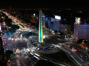 The Obelisk is lit up in the Brazilian team colours of yellow and green in Buenos Aires June 10, 2014. (REUTERS/Enrique Marcarian)