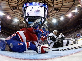 Dan Girardi of the New York Rangers slides into the net after a play at the net against the Los Angeles Kings during the third period of Game 3 of the Stanley Cup final at Madison Square Garden on June 9, 2014. (Bruce Bennett/Getty Images/AFP)