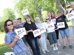 Letter carriers and supporters out for the Walk With Your Letter Carrier June 7. Left to right: Michelle White, Joe Duarte, Scott Buckle, a former postal worker who declined to give her name, Murla Mcmahon, Carol Duval, Julie Picott, Sue Sitlington, and Barry Campbell gather for the walk at Alexandra Park in Strathroy.  ELENA MAYSTRUK/ AGE DISPATCH/QMI AGENCY