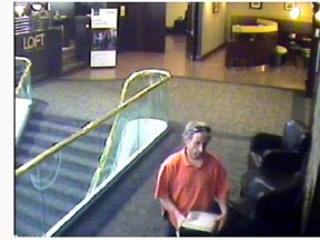 A man was captured on security camera leaving the event at a Hamilton Sheraton hotel with the box. (Hamilton Police Services handout)