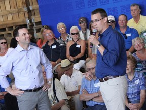 Residents ask questions of Progressive Conservative provincial leader Tim Hudak (left) and MPP Monte McNaughton on June 7.  ELENA MAYSTRUK/ AGE DISPATCH/ QMI AGENCY