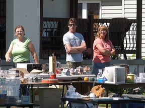 Bargain hunters look over the deals at the Tupperville town-wide yard sale held on Saturday. Wallaceburg and Dresden are both holding their town-wide yard sales this upcoming Saturday (June 14).