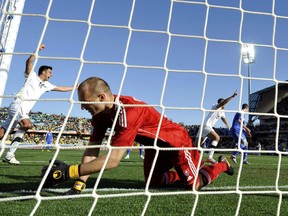 New Zealand's Winston Reid celebrates after scoring past Slovakia's goalkeeper Jan Mucha during a 2010 World Cup Group F soccer match at Royal Bafokeng stadium in Rustenburg June 15, 2010. (REUTERS/Dylan Martinez)