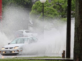 The Kingston area was hit with heavy rainfall on Wednesday, and more is expected Thursday. Storm drains overflowed onto local streets, like Kingston Street in Portsmouth Village, causing flooding in some areas. Julia McKay/The Whig-Standard
