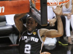 Spurs forward Kawhi Leonard dunks against the Miami Heat in the NBA Finals. (USA TODAY SPORTS)