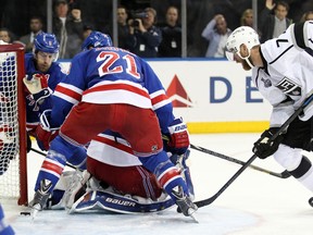 Kings centre Jeff Carter looks for a loose puck in front of Rangers goalie Henrik Lundqvist on Wednesday night in New York. (Jerry Lai/USA TODAY Sports)