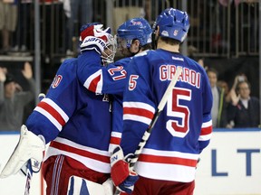 Rangers teammates congratulate goalie Henrik Lundqvist after winning Game 4 against the Kings. (USA TODAY SPORTS)
