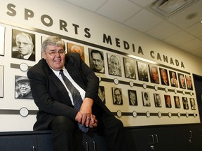 (7) _02SPO-JONES-oct15_  _Edmonton Sun sports columnist  Terry Jones is receiving a hall of fame award from Sports Media Canada on Tuesday October 16, 2012. Jones sitting in front of past inductees in the press box at the ACC.  SPO-JONES-oct15_ Craig Robertson Toronto Sun/QMI Agency