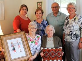 The "Malaka Bunch" is a group of local Ukrainian-Canadians following events overseas with keen interest. In the back are Sally Smolly (left), Julie Czekurlon, Phil Hrycak and May Mackuch. In the front row, Amilia Uchacz and Nell Hrycak. They meet regularly to discuss current events and dine on Ukrainian food.