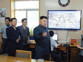 North Korean leader Kim Jong-un gives field guidance to the Hydro-meteorological Service in this undated photo released by North Korea's Korean Central News Agency (KCNA) in Pyongyang on June 10, 2014. (REUTERS/KCNA)