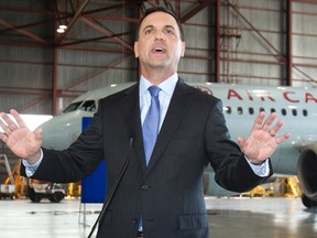 Provincial Conservative Party Leader Tim Hudak speaks to the media about job creation in an Air Canada hanger at Pearson International Airport in Mississauga, Ontario June 12, 2014. REUTERS/Fred Thornhill