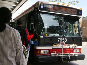 Riders prepare to board a Flemingdon Park bus before it leaves the TTC's Broadview subway station on Wednesday. (VERONICA HENRI/Toronto Sun)
