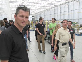 Hilco Tamminga, one of the three owners of Truly Green, the 22.5-acre greenhouse in Chatham, showed members of a Guelph-based agricultural tour through the new facility on Thursday. Truly Green grows tomatoes that will be using waste heat and waste carbon dioxide from the GreenField Ethanol plant across the road.