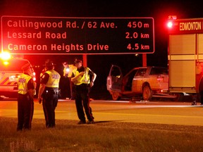 Police investigate after a man was hit and killed  by a vehicle on Anthony Henday Drive in the southbound lanes north of Callingwood Rd. Police are investigating the death of a Good Samaritan who was hit and run by a vehicle after stopping to help another motorist change a flat tire along the Anthony Henday Drive in west Edmonton.  DAVE LAZZARINO/EDMONTON SUN