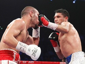 Arash Usmanee connects with a left during his April bout against Ray Beltran in Las Vegas. (Reuters)