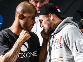 Flyweight champion Demetrious Johnson (left) and contender Ali Bagautinov (right) square off during UFC 174 media event in Burnaby, B.C. on Thursday, June 12, 2014. UFC 174 will take place June 14 at Rogers Arena In Vancouver. (Carmine Marinelli/QMI Agency)