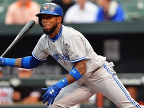 Toronto Blue Jays shortstop Jose Reyes hits a single against the Baltimore Orioles at Camden Yards in Baltimore, June 12, 2014. (TOMMY GILLIGAN/USA Today)