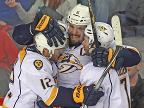 Predators captain Shea Weber (centre) won’t be going anywhere this off-season according to Nashville GM David Poile. (QMI AGENCY)