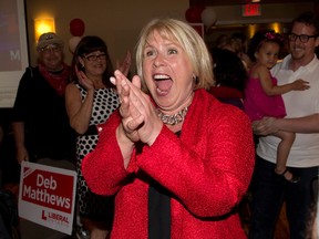 A jubilant Deb Matthews enters her victory party after winning the riding of London North Centre in London, Ontario on Thursday, June 12, 2014. DEREK RUTTAN/ The London Free Press /QMI AGENCY