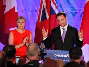 Ontario Progressive Conservative leader Tim Hudak concedes defeat in Ontario's election as his wife Debbie Hutton stands by his side in Grimsby, Ontario June 12, 2014. (REUTERS/Fred Thornhill)
