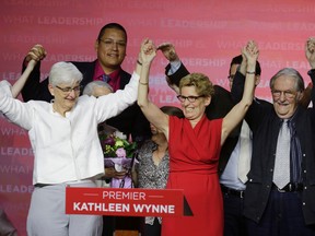 Premier Kathleen Wynne celebrates the Liberal victory with partner Jane Rounthwaite in Toronto on Thursday, June 12, 2014. (Craig Robertson/Toronto Sun)