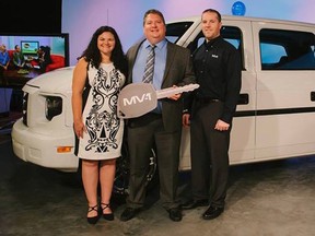 Photo courtesy of Marissa Moss, for the National Mobility Equipment Dealers Association
Kyle and Paula Watson, of Val Therese, accept the keys to their new MV-1 accessibility vehicle from Ryan Zemmer, marketing manager for Mobility Ventures, a subsidiary of AM General, in Tampa Bay, Fla.