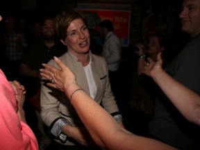 NDP candidate Mary Rita Holland greets a supporter Thursday night