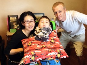 Kazumi and David Alsemgeest and their son, Rey. Two of the couple's three children suffer from Batten Disease.