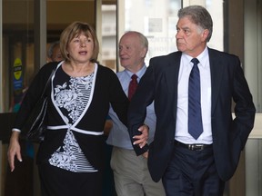 London mayor Joe Fontana walks out of the court house with his wive, Vicky, after being found guilty on three fraud related charges in London, Ontario on Friday June 13, 2014. Fontana will be sentenced on July 15.
CRAIG GLOVER/The London Free Press/QMI Agency