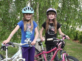 Seven-year-old twins Kyra and Mya Cooper have taken bike riding safety to the next level, competing in and winning a recent mountain bike race. - Karen Haynes, Reporter/Examiner