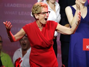 Liberal Leader Kathleen Wynne celebrates the Liberal party's majority re-election on Thursday, June 12, 2014. (CRAIG ROBERTSON/Toronto Sun)