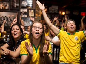 Fans in Edmonton cheer on Brazil during the opening game of the World Cup.