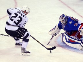 Los Angeles Kings captain Dustin Brown scores on New York Rangers goalie Henrik Lundqvist during Game 4  of the Stanley Cup final at Madison Square Garden.  (Ed MulhollandUSA TODAY Sports)