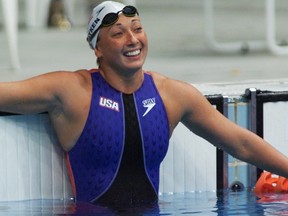 In this file photo dated September 22, 2000, shows U.S. swimmer Amy Van Dyken watching the time board after her 50m freestyle heat at Sydney International Aquatic Centre during Sydney 2000 Summer Olympics. (AFP PHOTO/TIMOTHY CLARY/FILES)