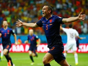 Stefan de Vrij of the Netherlands celebrates after scoring a goal against Spain during their 2014 World Cup Group B soccer match at the Fonte Nova arena in Salvador June 13, 2014. (REUTERS/Tony Gentile)