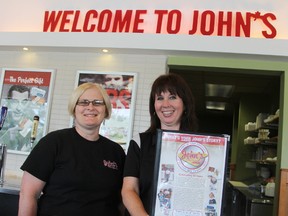 Managers Mary-Helen Doucet, and Laurie Laurin show off a 50th anniversary menu at John's Restaurant. The Sarnia landmark eatery focuses on quality food, service, and lots of Canadian bacon. TYLER KULA/ THE OBSERVER/ QMI AGENCY